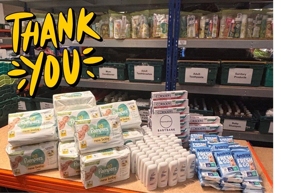 Packs of nappies, wipes and baby toiletries on a table